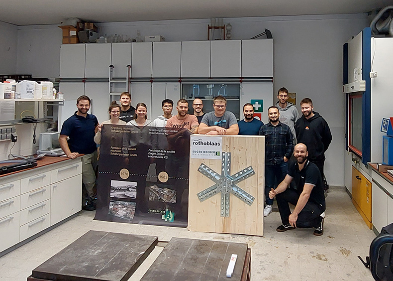 Participants in the practical workshop with a SPIDER Connector installed in a CLT element